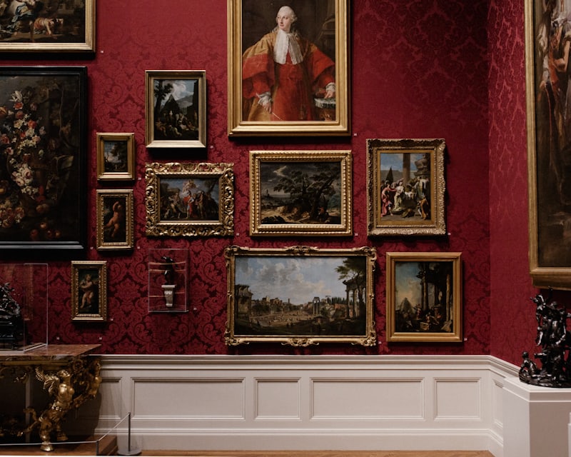 A visitor listening to an audio tour on their phone in a museum gallery